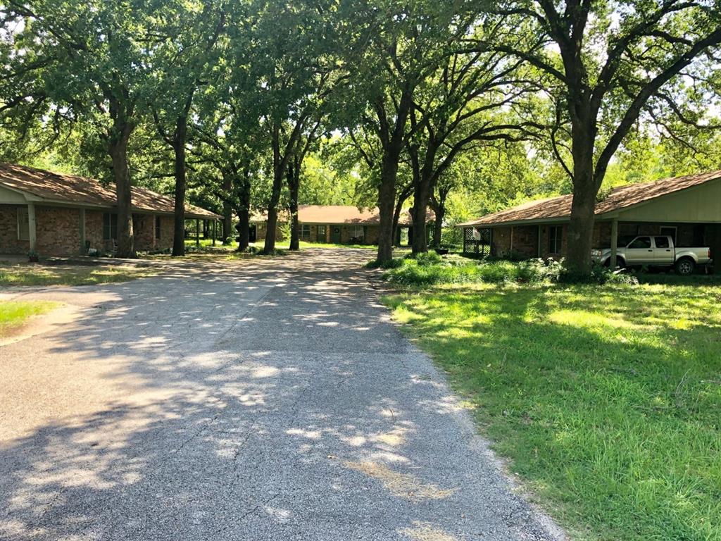 Great Investment in THREE Duplexes near downtown CANTON!  The units are all leased and each brick unit has front and side porches, large rooms and closets, outside laundry rooms and carports. There is room to build two more in the front of the property and has beautiful oak trees!