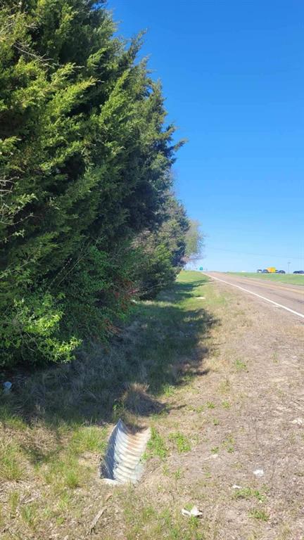 Chance to own a 5 acre lot situated in the county, on the I-45 service road in Palmer.  This heavily treed lot, located next to I-45, with easy travel to Wilmer, Ferris, and Ennis.  Land is partially located in AE flood zone.