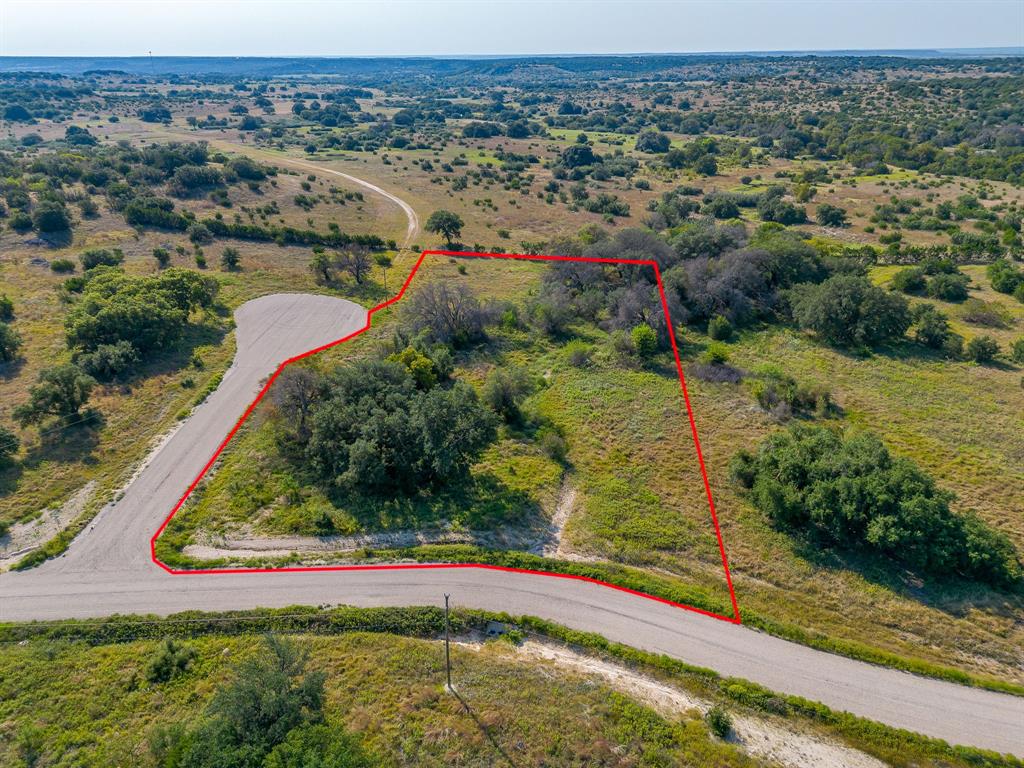 Come enjoy country living in this unique subdivision offering scenic views and plenty of wildlife. This great 2.58 acre corner lot in a cul-de-sac is a prime place to build. This community is gated, features scattered trees and community mailboxes. Residents will enjoy proximity to such attractions as Dinosaur Valley State Park, Fossil Rim Wildlife Center as well as nearby city conveniences. The community is slated to include several more amenities including walking trails and a fishing pond. While offering a quiet country setting it is close to Gen Rose and an hour's drive to Fort Worth. Come see this exceptional lot to build your dream home! Buyers will need their own septic and water well