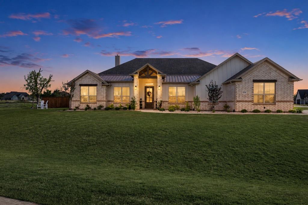 When you enter into this modern farmhouse through the front door you will be struck by the soaring 12 foot ceilings in the main living space. Wood-like tile floors and sleek quartz counters combine with the ample natural light to bring an airy feel to the home. Custom features include cedar beam accents in the living room and primary bedroom, oversized utility room with mud bench, sink and counterspace, and floor to ceiling tile fireplace in the living room. The large primary suite includes a soaking tub and walk in shower. The second bedroom also has an en suite bathroom with an oversized walk in shower and walk in closet. Front office can be used as a fifth bedroom or guest room with closet space. This meticulously upgraded home delivers 2,349 sq ft of refined comfort with over $60,000 in premium improvements already done for you. Step outside to a private oasis framed by a custom 8-ft board-on-board privacy fence, mature pistachio trees, designer river rock landscaping, decorative stained concrete patios, and elegant exterior uplighting with timers. Inside, $12,000 in custom motorized window treatments dress every window with sophistication. Breathe easy with a whole-house water filtration system, reverse osmosis, ERV fresh air ventilation, and whole-house air purification, heated toilets with bidet — a rare combination delivering hotel-quality air and water throughout. 2-car garage + golf cart garage, and a thoughtfully designed layout round out this move-in ready gem. No projects. No contractors. No waiting. Just move in and enjoy. Community provides 2 pools to enjoy, grocery shopping onsite and 2 golf courses to enjoy & a nice selection of restaurants.
