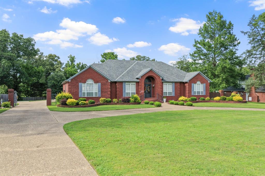 Quintessential traditional design and exceptional craftsmanship adorn this timeless Thomas Brothers home. The open floor-plan is just shy of 3,600 sqft, contains 3 bedrooms, 2.5 bathrooms, and features tall ceilings, storage abound, and attention to detail. From the stately front porch boasting wrought iron double doors into grand entry, formal dining and living rooms welcome you to the home. The chef pleasing kitchen flows into a cozy den featuring a corner gas fireplace and floor to ceiling windows that showcase serene views and flood the space with warm natural light. Two guest bedrooms are adjoined by a jack and jill bath, and the larger of these has been reconfigured into a mother-in-law suite. Sequestered from the rest, the luxurious primary suite is ideal for R&R. Melt away your stress in the spa-like ensuite bathroom complete with a deep soaking tub with solid granite surround, separate shower, his and hers vanities, and a walk in closet sure to please the fashionista in your life, before further unwinding by the private fireplace then turning in. Outside, the curb appeal is second to none. This entire, almost 1 acre, property has been thoughtfully landscaped and meticulously maintained for endless entertaining. In addition to the circle drive designed to accommodate guests galore, the oversized-yet-intimate back patio provides ample space to create the backyard event of your dreams, while the custom gate safeguards access to the 3 car garage, private parking area, and man cave-cabana. Don’t miss out on the opportunity to make your dream a reality! Schedule a private tour today!