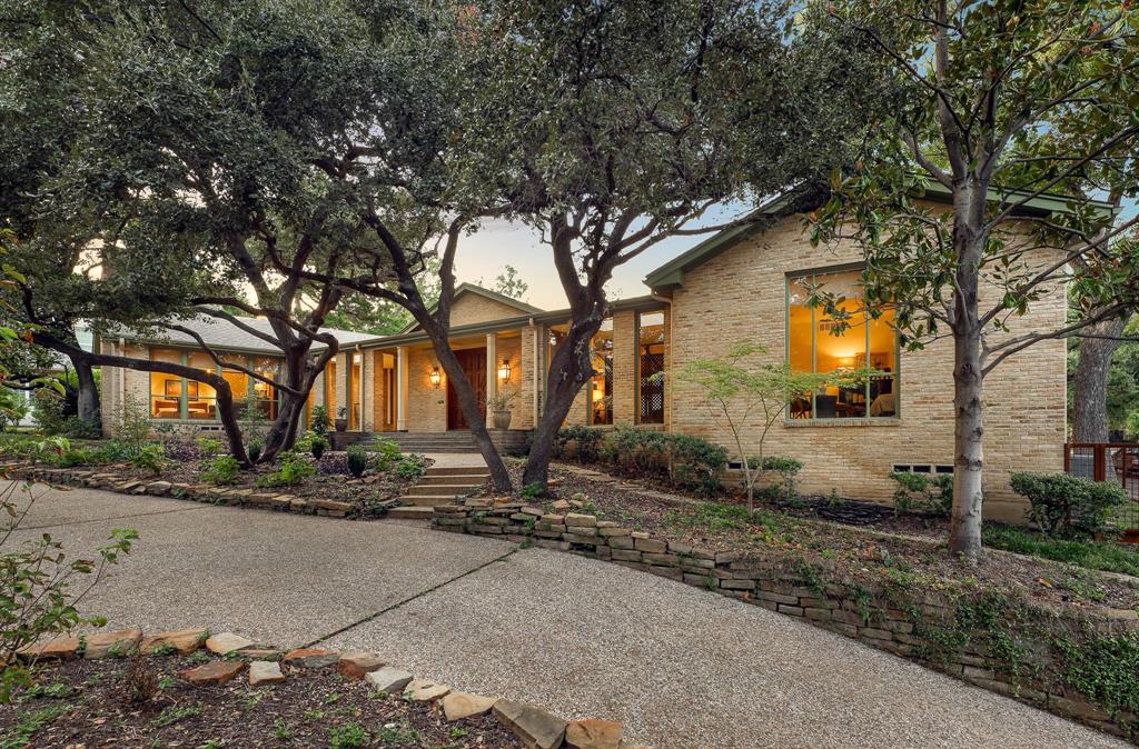 Welcome to 909 W Colorado Blvd - a mid-century masterpiece nestled in the heart of Kessler Park. This architectural gem is believed to be the only home in Oak Cliff designed by the renowned architect Robert J Perry. Custom built in 1966, the home is a true testament to the era’s distinctive style. It has been thoughtfully restored, seamlessly blending modern conveniences with period-appropriate details, honoring the home’s original character. This single-story residence features four spacious bedrooms, four bathrooms, indoor gardens, a wet bar, a great room, ample storage, and a three-car carport all set on a beautiful .44-acre lot with a pool. From the expansive windows that bathe the interiors in natural light to the rich wood finishes and clean lines that define its aesthetic, every element of this home has been carefully considered. For lovers of mid-century design, here is a rare opportunity to own an architecturally significant home in one of Dallas' most coveted neighborhoods.