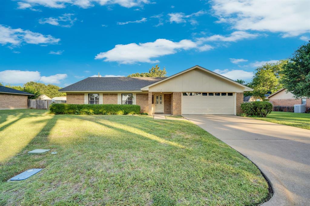This well maintained 3 bedroom, 2 bath and 2 car garage brick home in the desirable Country Club Estates neighborhood in Hillsboro sits on 0.26 acres and offers 1,666 square feet of comfortable living space. Built in 1979, the home features a wood burning brick fireplace in the living room, a planter box in the entry, and carpet-vinyl flooring throughout. The spacious master bath includes two walk-in closets, two dressing areas, and two separate vanities. Large backyard with wood and wrought iron fencing, concrete sitting area in the back round out the property. The roof was replaced two years ago and the AC is newer, giving the next owner peace of mind on the big ticket items. With a prime location in an established neighborhood, this home just needs a little updating to really shine. A solid opportunity in a sought after area of Hillsboro.