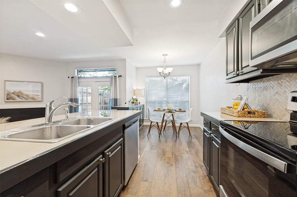 Welcome to effortless Dallas living in this meticulously maintained 1-bedroom, 1-bath condominium nestled in a highly desirable location where comfort, convenience, and low-maintenance living come together beautifully. Situated on the first floor, this light-filled home offers an inviting open-concept layout with beautiful flooring throughout & a bright, airy atmosphere that instantly feels welcoming. The open kitchen seamlessly connects to the living area, creating a functional and comfortable space ideal for both everyday living and entertaining. Adding even more value, the refrigerator (2022), washer & dryer (2025) all convey with the home, & the HVAC (interior & exterior) was replaced in 2025, making this an exceptional move-in-ready opportunity. One of the standout features is the spacious private enclosed patio—your own outdoor retreat complete with a beautiful mature tree that creates a peaceful setting to enjoy morning coffee, relax with a book, or unwind at the end of the day. Thoughtfully maintained & meticulously cared for, this home also includes a covered reserved parking space conveniently located close to the unit for added ease and accessibility. Residents enjoy the benefits of HOA-maintained living, including a gated entrance, community pool, beautifully maintained grounds,  common areas, allowing for a lock-and-leave lifestyle with less upkeep and more enjoyment. Outdoor enthusiasts will appreciate having the SOPAC Trail just steps away, for walking & biking. The highly desirable Dallas location places you close to, NorthPark Center, Presbyterian hospital, dining, shopping, & entertainment. Light, bright, & exceptionally maintained, this charming condominium offers comfort, convenience, and an unbeatable location—everything you need to enjoy easy Dallas living. Light, bright & exceptionally maintained, this charming condominium offers comfort, convenience, & an unbeatable location - everything you need to enjoy easy Dallas living.