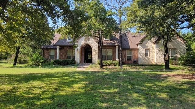 Located on 2 private acres surrounded by mature trees, this 4-bedroom home offers space, privacy, and flexibility just minutes from Lake Ray Roberts.

Inside, the home features a functional layout with a split primary suite for added privacy, a dedicated guest room, and two additional bedrooms connected by a second living area—perfect for a game room, media space, or kids’ hangout.

The main living area includes a wood-burning fireplace, built-ins, and abundant natural light throughout. The layout flows comfortably for both everyday living and entertaining.

Upstairs, the oversized bonus room provides additional flexibility as a home office, playroom, or media room, complete with extra storage.

Enjoy outdoor living on the covered back patio, with a mix of shade and sunlight across the property—ideal for relaxing or hosting.

Priced with updates in mind, this property presents a compelling opportunity to own a private, acreage property at an attractive value.

If you’re looking for space, privacy, and the ability to make a home your own all within close proximity to the lake, this is a rare opportunity worth seeing.