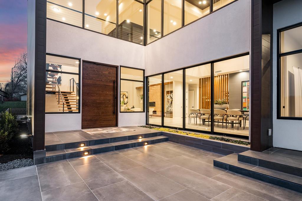 Introducing an architectural masterpiece crafted by B3 Home Builders, this newly constructed modern estate epitomizes luxury living. Nestled on over an acre just off the esteemed White Chapel Boulevard in Southlake, you will find the feeling of country living but just blocks from Southlake Town Square. The striking facade immediately captures attention, with clean lines and sleek finishes that reflect its modern design that showcases the  meticulous attention to detail at every turn. Expansive windows adorn the walls, bathing the interiors in abundant natural light and offering panoramic views of the lush surroundings, creating a sense of connection with the outdoors. One of the highlights of this remarkable home is its dual primary bedroom suites, located upstairs and downstairs. Beyond the luxurious interiors, this estate is also designed for outdoor enjoyment and recreation with plenty of room that allows homeowners to create their own private oasis beyond the louvered Pergola.