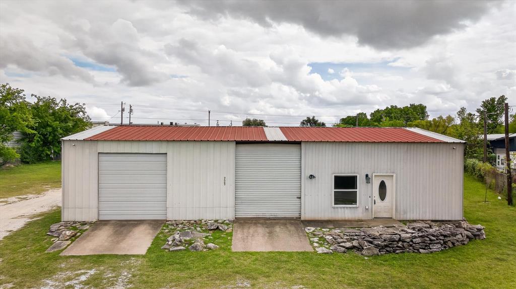 What a deal! This unique property can be used as either commercial or residential. Perfect set up for a work from home business. This property boasts a half acre of land, 1800 sqft building, complete with full live in area, including 2beds-1bath, full kitchen and living room, one large carport, and two large garages. Plenty of parking and room to run your business. Building has a metal roof. Refrigerator included in sale. Air Conditioner replaced in 2024 with a 2.5 ton unit.  Low taxes! Property to be sold as is.