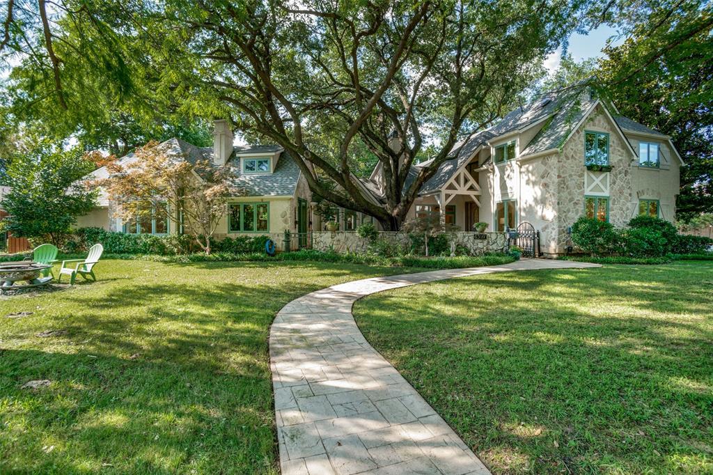 Discover the timeless allure of this exquisitely updated home, situated on a storied Preston Hollow lot with majestic century-old trees. This residence blends classic charm with contemporary sophistication. The recent enhancements, including new windows & patio doors, a fully remodeled kitchen featuring new cabinets, countertops, appliances, Quartzite island, & wood floors. Three living areas, one with a new dry bar & a beverage fridge.
The owner's wing has a study with a fireplace & vaulted ceilings, & a serene view of the front courtyard. The main bedroom, with its vaulted ceiling & fireplace, has French doors to a covered terrace. The master bath has been meticulously updated. Upstairs offers a wing with 3 charming bedrooms & refreshed baths. A separate bedroom or game room with full bath, & a private staircase is perfect for guests or older children. Beautiful backyard with pool, fountain & covered areas. This is one of old Preston Hollow's most enchanting homes.