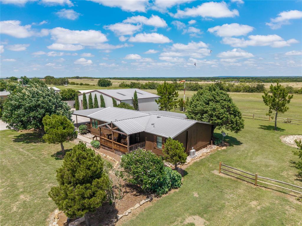 Pilots, your next home is cleared for landing! Live the aviation lifestyle you’ve always dreamed of on nearly 2 acres with direct access to a private airstrip just outside the city limits of Early, TX. 

This well-maintained 3-bedroom, 2-bath home offers walk-in closets, a spacious living room with a charming barn door, and a kitchen equipped with a stainless-steel refrigerator, dishwasher, and Culligan water filtration system. The primary suite has been beautifully upgraded with a standalone soaking tub and ceramic tile shower, creating the perfect retreat after a day in the air.

Step outside to enjoy views of the runway from your spacious covered back deck. You will also find a fire pit, hot tub pad with electrical already in place, and a storm cellar. Additional features include a two-car carport, RV and trailer parking, outdoor LED lighting, upgraded double-pane windows, and a sliding glass door.

The 40x60 hangar (shop) has large bay doors and a 10' roll up electric door. This property is located on Flying S Air Ranch, includes a few peach and fig trees, plus plenty of room for a large vegetable garden. This property gives you the perfect blend of country living, aviation convenience, and it's just moments from local amenities such as schools, shopping and dining.

Why drive to the airport when you can live on the runway? Call today for a private showing!
