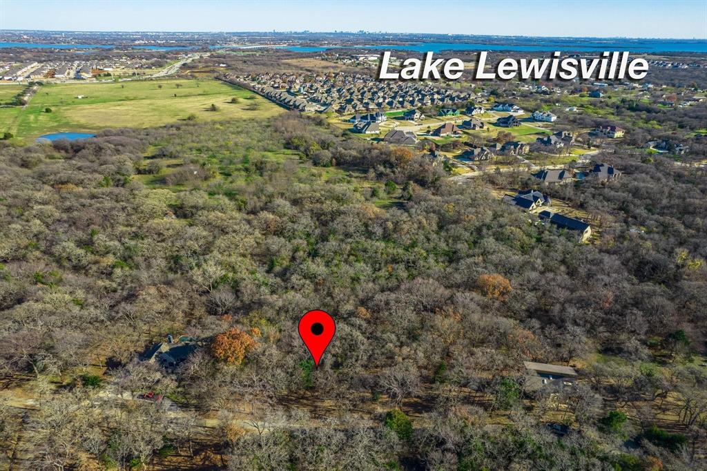 Amazing treed lot in Yacht Club Estates perfect for an individual or an investor.  Location is perfect for building a dream home!  Owner has done some research into building, and location of potential residence shown on attached document.  Any residence must be at least 1600 sq ft and septic system will be required.  No HOA.  Convenient to Little Elm and Frisco!