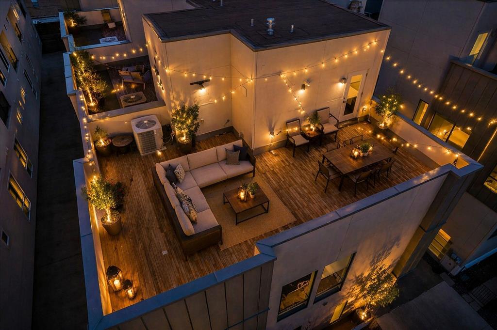 Experience modern city living at its finest in this stunning three-story townhome with NO HOA. Offering over 2,100 square feet of exceptional living space, this contemporary home features sleek designer finishes throughout, including bold hardwood floors, ease of convenience with a central vac & dumb waiter, touchless sinks, stylish tile, and an abundance of windows that flood the home with natural light. The gourmet kitchen is beautifully appointed with white shaker cabinetry, stainless steel appliances, a wine fridge, and modern finishes perfect for entertaining or relaxing after a long day. Electric modern shades add both convenience and sophistication. This thoughtfully designed floor plan includes three spacious bedrooms, each with its own private en-suite bath, plus a convenient powder bath for guests. Take the entertaining outdoors to the spectacular rooftop patio where you can enjoy breathtaking views of the Dallas skyline the perfect setting for evening gatherings or quiet mornings with coffee. Located within walking distance to shops, restaurants, and vibrant city life, this home is ideal for the business professional or anyone looking to embrace the energy and lifestyle of Dallas. Location truly says it all—location, location, location.