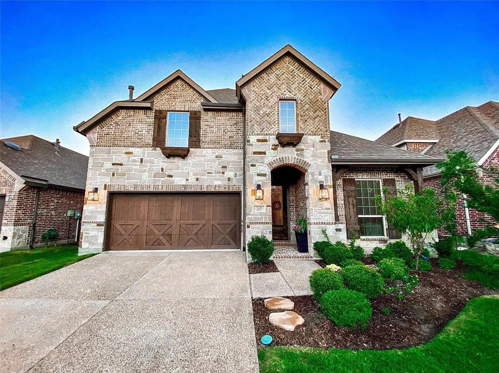 Discover luxury living in this stunning five-bedroom, four-bath home in Castle Hills, one of North Dallas' most sought-after master-planned communities. Hand-scraped hardwood floors flow seamlessly throughout both levels - a dramatic upgrade from the carpeted upstairs and staircase you'll find in comparable homes nearby.

Residents enjoy resort-style living with 7 community pools, over 25 parks and playgrounds, 6+ miles of hike-and-bike trails, a 12-acre fishing lake, tennis, pickleball and basketball courts, sports fields, and fitness centers - all just minutes from Grandscape, TopGolf, and the new HEB and Costco arriving in 2026. The award-winning Lakes at Castle Hills championship golf course sits within the community.

Inside, soaring ceilings and abundant natural light create an elegant backdrop for everyday living. The spacious master suite features quartz countertops and a walk-in closet. EV-ready with 240V charging for multiple cars in the garage, this home is fully upgraded and move-in ready - with network data wiring to every room, prewired surround sound, prewired surveillance system, and whole-house water filtration.