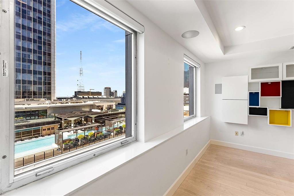 This price shouldn't exist in this building. The unit one floor up sold for $590,000 — same address, same views, same full-service luxury. Someone is going to get an absolute steal here, and it might as well be you.

Inside the iconic George Dahl-designed 1505 Elm Street, this rare 3-bedroom, 3-bath home delivers everything you would expect at twice the price: Dallas skyline views, a full Thermador kitchen with dual convection ovens, wine refrigerator, quartz countertops, Italian tile backsplash, and ceiling-height custom cabinetry. Bamboo floors, Hunter Douglas automated blinds, built-in speakers, in-wall subwoofer, Nest and Alexa integration, and keyless entry complete a long list of high-end finishes. Private storage with built-in shelving sits directly across the hall.

Life at 1505 Elm is effortlessly luxurious. Just 68 residences, and the building takes care of everything — 24-hour concierge and valet for residents and up to five guests (and no tipping!) Rooftop pool with cooking pavilions, fitness center, theater, sauna, piano lounge, wine cellar with your own private locker in the original vault, and a private dog run. HOA covers all utilities except interior electric. This is true lock-and-leave living at its finest.
Steps from Michelin-recognized dining, the Arts and AT&T Discovery Districts, and DART Akard Station directly across the street. Effortlessly luxurious, completely upgraded, and priced in a way that won't make sense for long. See it before it's gone.