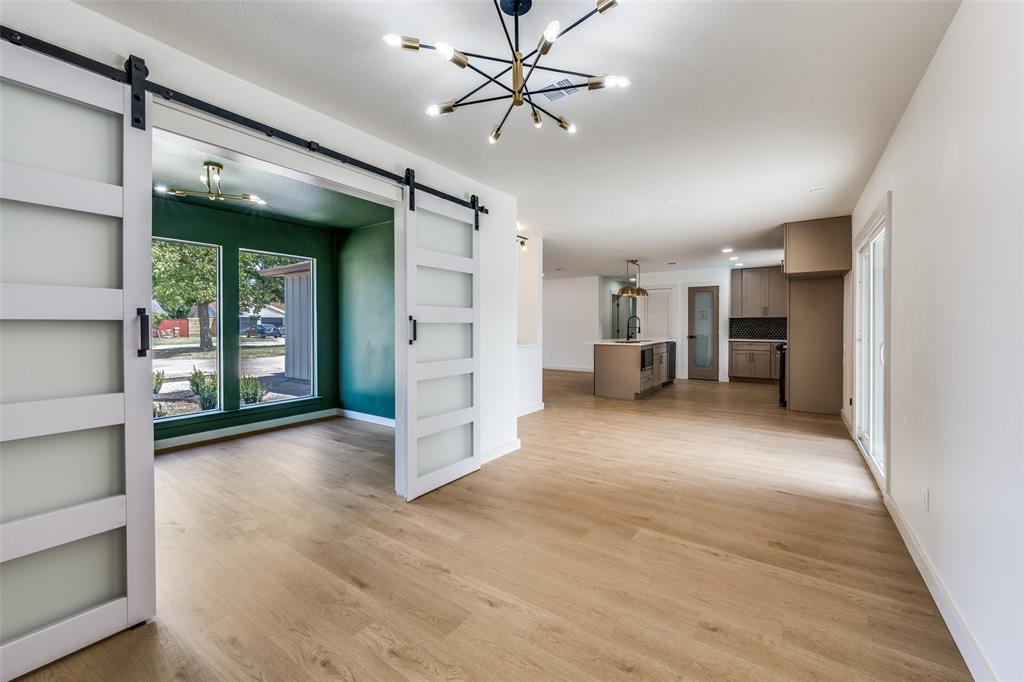 Welcome to 908 Raintree Road, a beautifully reimagined 3-bedroom, 3-bathroom home with a dedicated office, where luxury finishes meet quality craftsmanship. Completely renovated from top to bottom, this home offers the modern design and peace of mind today's buyers are looking for. Step inside to an open-concept layout featuring luxury flooring throughout, designer wall paneling, fresh paint, new lighting, and an impressive chef's kitchen with quartz countertops, custom cabinetry, a large center island with built-in microwave, and a spacious dining area with a bar, perfect for entertaining. The oversized primary suite is a true retreat, featuring a stunning 72-inch fireplace and a spa-inspired bath with floating dual vanities, a freestanding soaking tub, oversized double-entry shower glass with ceiling-mounted rain shower head  and designer tile finishes. Enjoy seamless indoor-outdoor living through the oversized sliding glass patio door leading to a large covered patio and beautifully replastered pool, perfect for relaxing or hosting guests. Major updates include all new PVC plumbing replacing cast iron, updated electrical panel, new HVAC, energy-efficient windows, roof approximately 2 years old, new fence, smart front door lock, modern interior doors, and beautifully remodeled bathrooms throughout. This exceptional home combines luxury finishes with major system upgrades, offering truly move-in-ready living in a convenient Fort Worth location. Schedule your private showing today!