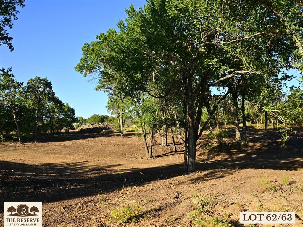 Come experience one of the most majestic lots in The Reserve at Taylor Ranch. Sitting at the end of a cul-de-sac that feels like another world, a canopy of mature oaks await your custom home. If you are dreaming of a custom home beneath a canopy of oaks and a hedge of trees along the back promising a lifetime of privacy, this one is for you! Nestled in the quiet countryside of Springtown and within the coveted Weatherford ISD, offering a rare opportunity to own acreage tracts that balance privacy, beauty, and freedom, all just minutes from town. Ranging from hilltop parcels with sweeping views to shaded, wooded retreats;  each one unique and full of potential. With rolling topography that rises nearly 90 feet, the backdrop is breathtaking, offering unforgettable Parker County sunsets and a peaceful rhythm of life that feels miles away from the noise, yet only 20–25 minutes from Weatherford and close to Springtown’s local dining, shopping, & amenities. The Reserve is a true escape, a neighborhood that prioritizes privacy, space, & quality. Build your dream home on your timeline with deed restrictions, no HOA, and the freedom to create a lifestyle that suits you. Enjoy underground electricity, no water bills, well and septic-ready lots, & Next Link Fiber Optic Connectivity, all while being nestled in a quiet community. It’s the kind of place where neighbors wave, stars shine brighter, and the land works with you, not against you. The Reserve at Taylor Ranch isn’t just a place to live, it’s a place to belong. Evenings here feel like stepping back in time, where you can wander under wide Texas skies, catch lightning bugs in the dusk, and enjoy the kind of quiet that lets you hear the breeze through the trees. This is your invitation to slow down, spread out, and savor the simple moments. Come walk the lots, take in the views, and imagine the possibilities. New single-family construction must have a minimum of 1,700 square feet. No Barndominiums.