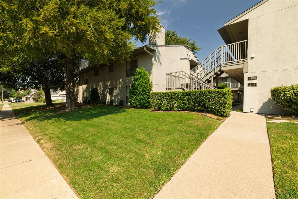 Welcome to you new home in the Culture District of Camp Bowie! This Charming two-bedroom, two bathroom condo offers an inviting blend of comfort, style and convenience- all in the highly desirable location. Both bedrooms are new freshly carpeted. The Living room and hallways sport beautiful wood-look laminate flooring for low maintenance and adds warmth and elegance. With a Corner fireplace in the living room. Kitchen area has unique wood countertops, nice and open to the dining area. This home has a full size laundry area. Enjoy the open patio for you morning coffee.  There are two car covered parking. GROUND FLOOR UNIT.