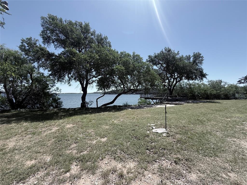 Beautiful lakefront property on Possum Kingdom Lake. Gated road, deep water, private boat ramp, sea wall, beautiful deck with large trees. Perfect lot to building your dream home. RV hookups intstalled.

Information should be considered to be reliable but must be confirmed by buyer and buyer's agent.