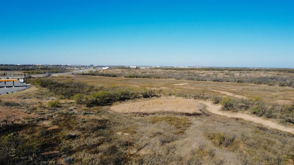 Discover the exceptional Griffith Ranch, a rare 218± acre land offering with sweeping panoramic views overlooking north Abilene. This expansive tract presents an outstanding commercial and investment opportunity in one of the city’s fastest-growing corridors.

The northern portion of the ranch is predominantly flat, featuring productive cultivated land with denser mesquite growth along the western edge. Easement access is available from Scottish Road to the northwest corner of the property. The southern boundary fronts East Overland Trail, with a major truck stop located just to the southeast—enhancing accessibility and commercial appeal.

Zoned for Light Industrial and Open Space, this multi-parcel property offers tremendous flexibility for future development. Its strategic location places it only minutes from both regional data center locations, the airport, major amenities, and hospitality services.

Griffith Ranch offers a wide range of development possibilities, including—but not limited to—retail, restaurants, manufacturing, RV parks, or long-term land investment. Opportunities of this scale and proximity are virtually unprecedented in the Abilene market, making this a true blank canvas for forward-thinking investors and developers.

Wildlife:
Whitetail deer, turkey, hogs, dove, quail, and varmints.