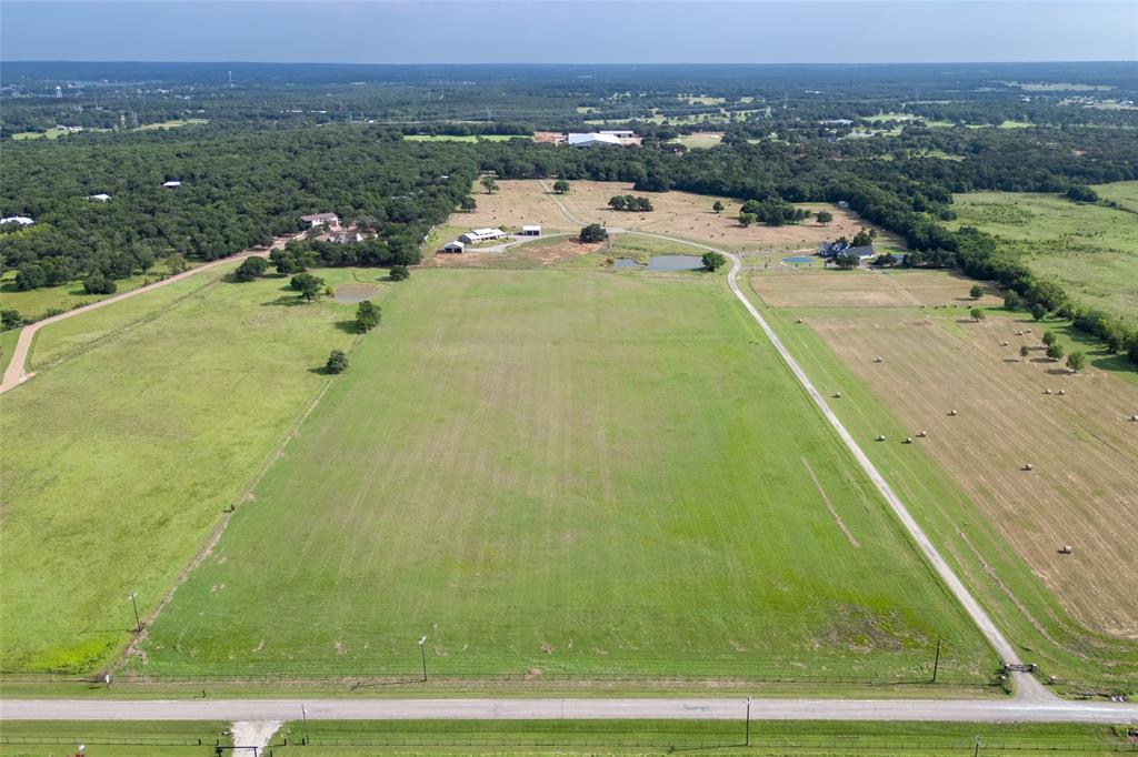 Perfect lot for your dream home! Beautiful 11 acre tract of land in desirable six tract gated development. Property is lightly deed restricted to maintain the integrity of the area. Nestled on a quiet paved road with a co-op water and underground electricity! Sandy loam soil and Ag Exempt offering lower property taxes. Easy commute to DFW metroplex. 1 hour to DFW International Airport. Minutes to Lake Ray Roberts State Park and Boat Ramp. Electricity and water on site (meter needed). Perfect location for your dream home or weekend get away.