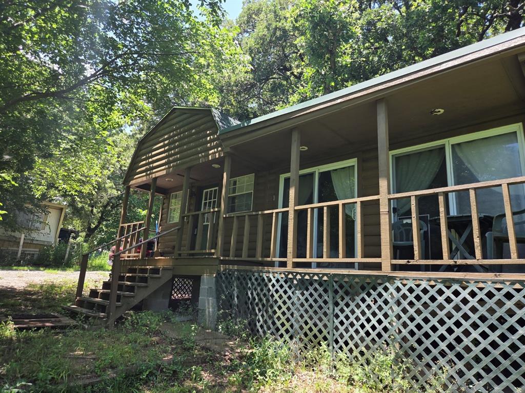 Escape to your own log-cabin-style retreat just minutes from Lake Texoma, boating, fishing, and the excitement of MegaStar Casino. Situated on four spacious lots, this property offers room to spread out, relax, and enjoy the outdoors year-round.

The cozy cabin feel pairs perfectly with a nice-sized garage and plenty of open space for RVs, boats, lake toys, and weekend guests. With no known restrictions, you have the freedom to use the property as a weekend getaway, full-time residence, or recreational basecamp.

Bring the toys, bring the family, and enjoy the best of Texoma living — whether you’re here for the weekend or settling in for good. all info to be verfied by the buyer