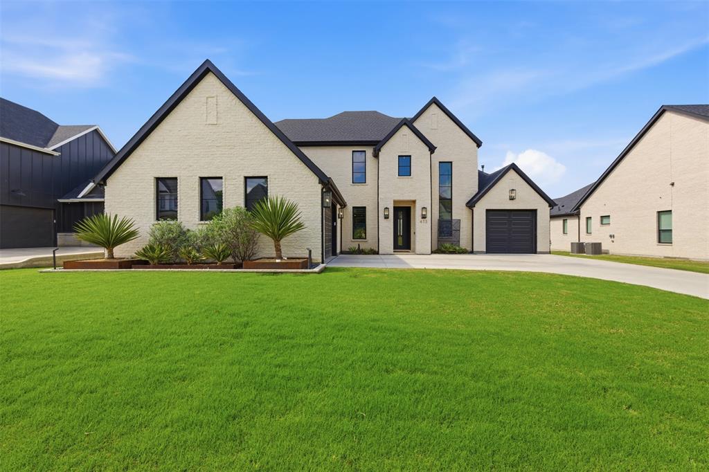 This exceptional custom-built contemporary home offers 3 bedrooms, 3 full baths, and 3,267 square feet of thoughtfully designed living space on an oversized lot. Built in 2023 with extensive high-end upgrades, this home seamlessly blends modern elegance with everyday functionality.

The open-concept layout is anchored by a stunning chef’s kitchen featuring a commercial-grade gas range, oversized island, farmhouse sink, butler’s pantry, and custom cabinetry—perfect for entertaining or daily living. The spacious living area showcases a gas fireplace and flows effortlessly into the dining space.

The private primary suite is a true retreat, complete with a luxurious ensuite bath offering dual vanities, a double shower, custom closet system, and a dedicated sitting area. Additional spaces include a first-floor exercise room, upstairs media room, and generously sized secondary bedrooms with walk-in closets.

Step outside to your own backyard oasis featuring a gunite, saltwater pool with water feature, covered patio, and large yard—ideal for relaxing or entertaining.

Additional highlights include a 3-car oversized garage, smart home capabilities, hardwood and tile flooring, decorative lighting, and abundant built-in storage throughout.

Located in a desirable community within Argyle ISD, with access to parks and playgrounds.

A rare opportunity to own a move-in ready, fully upgraded modern home with luxury finishes and resort-style living.