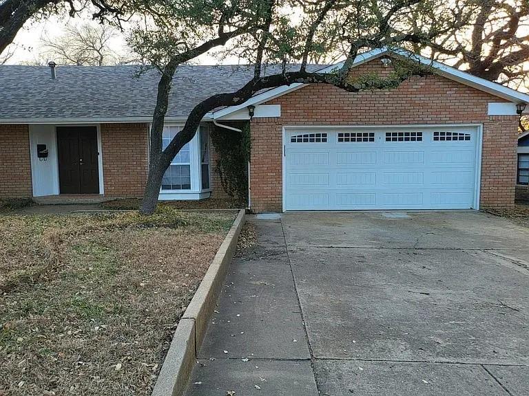 Spacious home with a flexible layout situated on a large, tree-covered lot! Inside, you’ll find vaulted ceilings, abundant natural light, and updated luxury vinyl plank flooring throughout much of the home. The oversized living area features a painted brick fireplace and opens seamlessly to the kitchen, creating a warm and inviting space for everyday living or entertaining.

The kitchen offers generous cabinet and counter space, granite countertops, tile backsplash, breakfast bar seating, and black appliances. The primary suite includes ample space along with a dual-sink vanity and large bathroom layout. Additional rooms provide versatility for a home office, second living area, workout room, or hobby space, with built-in shelving and workspace features throughout.

Step outside to an expansive backyard shaded by mature trees with plenty of room to relax, garden, or entertain. Conveniently located near shopping, dining, and major highways while offering a peaceful neighborhood setting full of character.