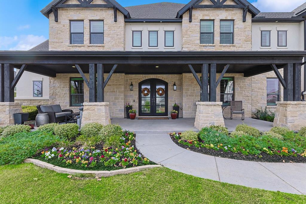 Welcome to a residence where luxury and thoughtful design meet at every turn. As you approach via the grand circular driveway, the elegant front porch and lush landscaping immediately captivate. Inside, this meticulously maintained, one-owner home exudes sophistication with custom finishes, refined upgrades, and every detail considered.Designed for effortless entertaining, the home features two 12’ sliding glass doors with electronic bug screens that create a seamless transition between the indoors and the expansive outdoor oasis. Relax in the custom-designed Claffey swimming pool featuring tanning ledge + water features complete with 12 person hot tub, outdoor kitchen, 3x7 Benswinger fireglass firepit seating area, added Equinox covered area with electricity, electronic screens allow for your outdoor living space to be transformed into a screened in porch AND priceless sunset views. Plantation shutters & custom drapes add classic elegance throughout the interior. Designer light fixtures, hardware and custom built in cabinets in the office, game room & media room completed and ready for your enjoyment. High end California Closets in 4 bedrooms and pantry. Smart living is at your fingertips with Control 4 System managing all AV equipment and Aqualink system for the pool equipment. The layout includes two bedrooms downstairs and three upstairs, each with a private en-suite bath, offering both privacy and convenience. The media room with stadium multi functional theatre seating elevates the home entertainment experience, while a heated and cooled storage room adds versatile space. Even the four-car garage has been transformed to luxury with upgraded commercial grade aluminum safety glass doors, Liftmaster Elite side mounted openers, built in elfa shelving and epoxy flooring. Custom xmas lights + wreaths are ready for the holiday season.  This home is a rare find, combining luxurious features, exceptional privacy, and an ideal setting for seamless indoor-outdoor living.