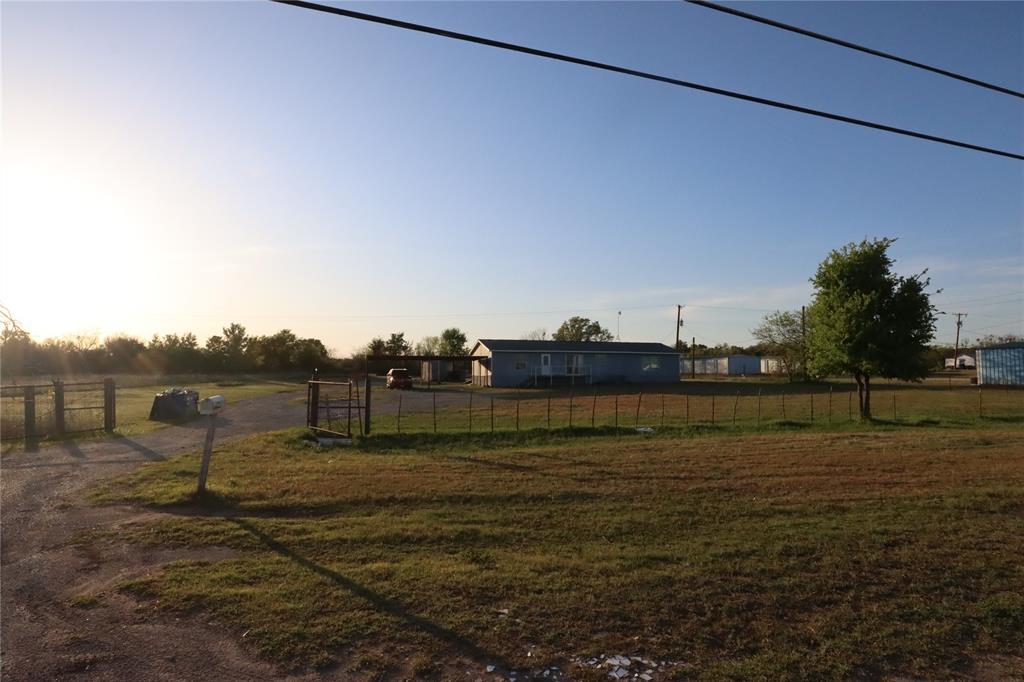 OPPORTUNITY, VISIBILITY, AND ACREAGE—ALL IN ONE! If you've been searching for a property with unlimited potential, this 2.5-acre property in Ranger, Texas deserves a closer look. Conveniently located on Loop 254 just minutes from IH-20 and positioned between Fort Worth and Abilene, this property offers the perfect blend of country living, business opportunity, and future development potential.

The existing double-wide mobile home provides a comfortable place to live while enjoying the freedom and space that acreage offers. Bring your horses, start a hobby farm, create a homestead, or simply enjoy the peaceful Texas sunsets and wide-open skies that make small-town living so appealing.

What truly sets this property apart is its exceptional flexibility. With excellent visibility and easy access from the interstate, this location could be an ideal site for a business looking to capture traffic traveling along IH-20. Whether you're considering retail, service-based operations, office space, storage, or another entrepreneurial venture, the location offers tremendous exposure and accessibility.

Investors and developers will also appreciate the property's subdivision potential. With 2.5 acres to work with, there may be opportunities to add another home, create additional income-producing properties, or establish a business alongside a residence. The possibilities are limited only by your vision.

Enjoy the charm of small-town Texas while remaining conveniently connected to larger markets and employment centers. Whether you're looking for a place to call home, a strategic business location, an investment opportunity, or a combination of all three, this property delivers the flexibility and potential you've been searching for.

Properties offering this much versatility and opportunity don't come along often. Schedule your private showing today and explore the possibilities for yourself!