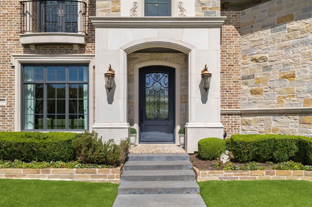 Tucked behind a gated entrance in Dallas' prestigious Private School Corridor, this exceptional French Country estate blends timeless architecture with thoughtful design and everyday livability. Surrounded by mature trees and beautifully manicured landscaping, the home makes an unforgettable first impression with its stately porte-cochère, welcoming courtyard, and impeccable curb appeal.
Inside, soaring ceilings, abundant natural light, rich hardwood flooring, custom millwork, and designer lighting create a warm yet sophisticated atmosphere. The well-designed floor plan offers generous living spaces, multiple gathering areas, and architectural details throughout, striking the perfect balance between grand entertaining and comfortable daily living.
The chef's kitchen serves as the centerpiece of the home, featuring an oversized island, professional-grade gas range, double ovens, warming drawer, built-in refrigerator, custom cabinetry, and exceptional prep and storage space. Whether hosting large holiday gatherings or enjoying a quiet evening at home, the kitchen seamlessly connects to the surrounding living and dining areas.
The private primary suite is a true retreat, offering a spa-inspired bath with dual vanities, a soaking tub, oversized walk-in shower, and expansive custom closet. Designed to embrace indoor-outdoor living, walls of windows and French doors open to multiple covered patios and peaceful outdoor entertaining spaces overlooking the lush grounds. The backyard offers a rare combination of luxury and recreation with a private putting green, playground, dedicated dog run, and plenty of room to relax or entertain.
Additional highlights include multiple staircases, epoxy-finished garage, extensive storage, and quality craftsmanship evident throughout every room.
Perfectly positioned near Dallas' world-class shopping, dining, and major thoroughfares,  With elegance that defines luxury living in one of the city's most sought-after neighborhoods.