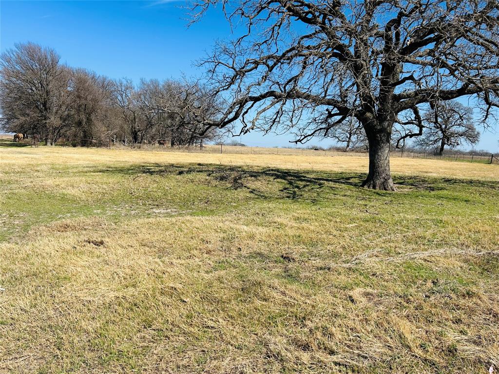 Nearly 12 acres ready to build on! The pictures are examples of what the seller has built in the past.This property offers a customizable 2000 sqft. barndominium shell with carport dried in to be built, which the price is reflecting.Seller is the contractor and can finish out the construction as well.There are no known restrictions, giving you the freedom to build and develop as you choose.The contractor is bonded and insured and does require 10% upfront.
Water is available — you’ll just need to install a meter — and electricity is already at the road. The land is completely fenced and has a  current AG exemption in place and ready for you to create your own homestead.
Located just minutes from the Brazos River and within Aquilla ISD, this property offers peaceful country living with plenty of space and potential.Call today to schedule your tour!
