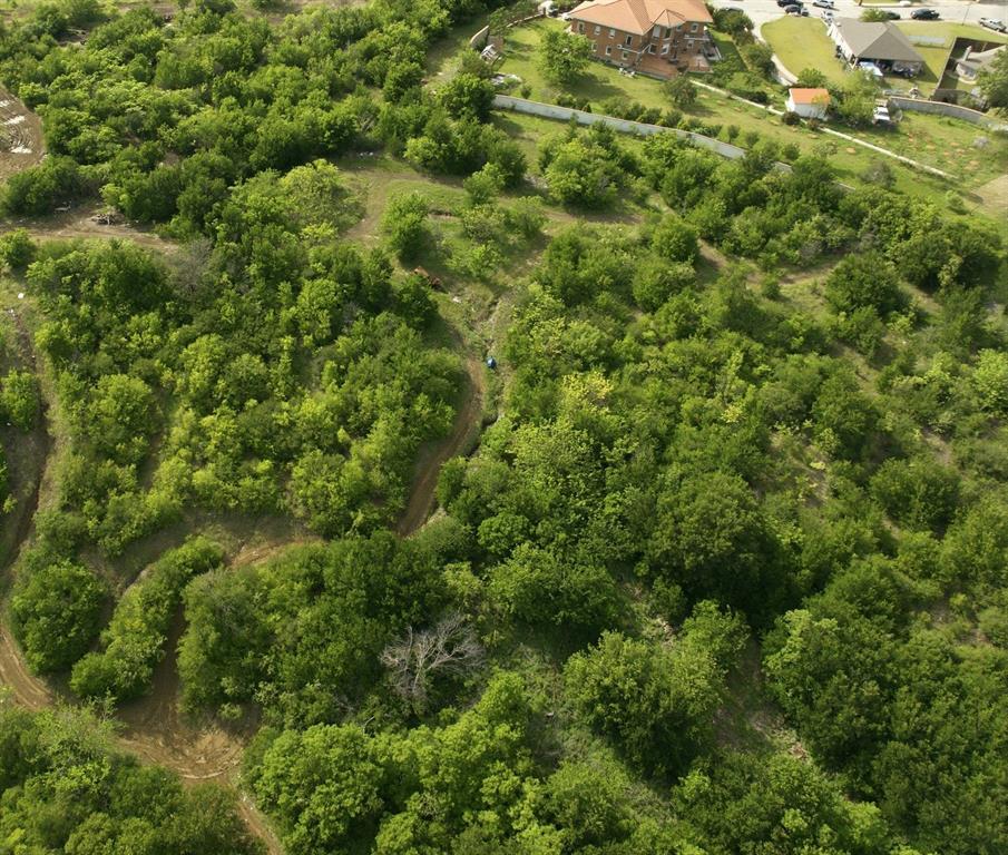 Discover the perfect canvas for your dream home. This vacant lot offers an exceptional opportunity to build in a centrally located area with stunning views overlooking Mountain Valley Lake. Nestled in an established setting, this property provides the ideal balance of convenience and natural beauty.
Whether you’re envisioning a custom luxury residence or a peaceful retreat, this homesite is ready to bring your vision to life. Enjoy scenic surroundings, nearby amenities, and the flexibility to design a home tailored to your lifestyle.
Unique opportunity to purchase this individual lot or expand your possibilities by acquiring the adjacent lot (Lot 58) for additional space and potential. Don’t miss your chance to secure a prime piece of land in a desirable Dallas location with captivating water views.