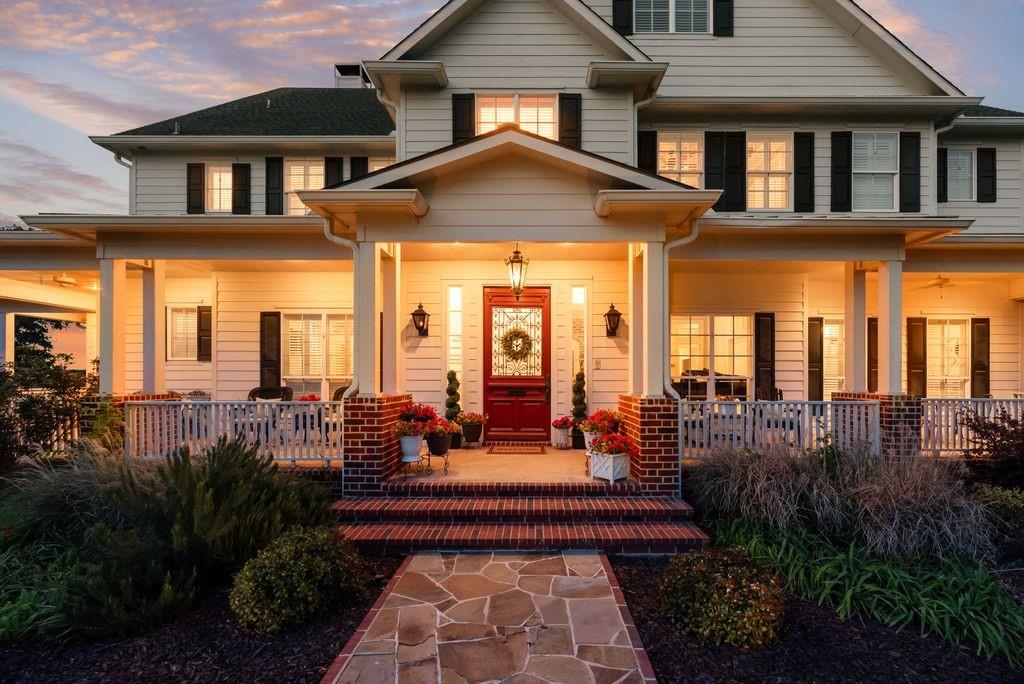 This stunning Southern Living-inspired dream home, situated on a sprawling 12.795 acre estate, blends timeless Southern architecture with modern luxury and functional recreational and equestrian facilities. TOTAL LIVING SPACE SF is 6,956.5 between the primary home and separate building. The property features a thoughtfully designed main house with a expansive front porch, custom millwork, light-filled living spaces, re-milled hand scraped wood flooring, and high ceilings with wood beams.  Additional interior features of this beautiful home include designer windows relocated from a Brookstone in NYC, several decorative transom windows, stained glass windows, plantation shutters, copper sinks, a variety of gorgeous light fixtures, antique washboard sink, luxurious primary bathroom with clawfoot tub and fireplace, decorative doors including dutch and barn doors, sophisticated wood and metal features throughout, a 5-Star 6-burner gas double oven, wet bar or wine area, office, reading room, gift wrap area, mudroom, formal living area, and over 400 sf of additional storage (no ac). The upstairs entertainment area features a HUGE game room (pool table stays) and media room (media chairs and projection equipment stays). And an extra plus - ALL bedrooms include ensuites with nicely sized walk in closets. 


Let's talk about the amazing outdoor oasis... This picturesque retreat includes a saltwater-chlorine combo pool and spa, fireplace, outdoor kitchen that includes a sink, gas grill, griddle and pizza oven. Additional features include a firepit, covered cabana with a daybed style swing, an enormous amount of open and covered space for entertaining, regulation size pickleball court, 1.5 acre pond, private gated entrance and entirely fenced. Last but not least, the 60x40 separate building has an additional 2 bedroom, 2 bath and open living-kitchen area, a great amount of storage capacity, and 4 walk-in horse stalls.