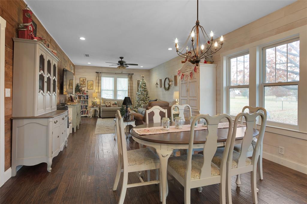 An open floor plan greets you in this charming 1931 home that has been beautifully updated inside.  New flooring throughout, including hardwood floors in main areas of the home.  Rustic shiplap original to the home in the living room, kitchen, dining and master bath.  Bathrooms have antique cast iron tubs stamped 1941 to keep with the original style of the home. New windows, paint, cabinets, countertops, etc.  This is a must see