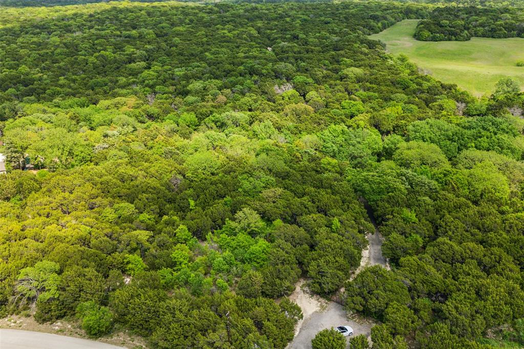 52 Secluded Wooded Acres in Cedar Hill – Bordering Dogwood Canyon Audubon Center! Discover 52 pristine wooded acres in the heart of Cedar Hill, TX, surrounded by the natural beauty of the Dogwood Canyon Audubon Center. This rare, private haven offers endless possibilities—whether you’re dreaming of a secluded estate, recreational retreat, or investment property. Enjoy the serenity of nature while staying just minutes from city conveniences. With an agricultural exemption in place, this property not only provides incredible privacy but also valuable tax benefits. Towering trees, rolling terrain, and abundant wildlife create a peaceful, picturesque setting unlike anything else in the DFW area. Located just a short drive from Joe Pool Lake, you’ll have easy access to boating, fishing, hiking, and more. Whether you’re looking to build your dream home tucked away in the woods or hold onto a legacy piece of land, this is a one-of-a-kind opportunity you won’t want to miss. Key Features: 52 heavily wooded acres. Bordered by protected Audubon land. Agricultural exemption in place. Near Joe Pool Lake and Cedar Hill State Park. Ideal for custom home, retreat, or recreational use. Abundant wildlife and natural beauty. Contact us today to explore this rare offering in person.