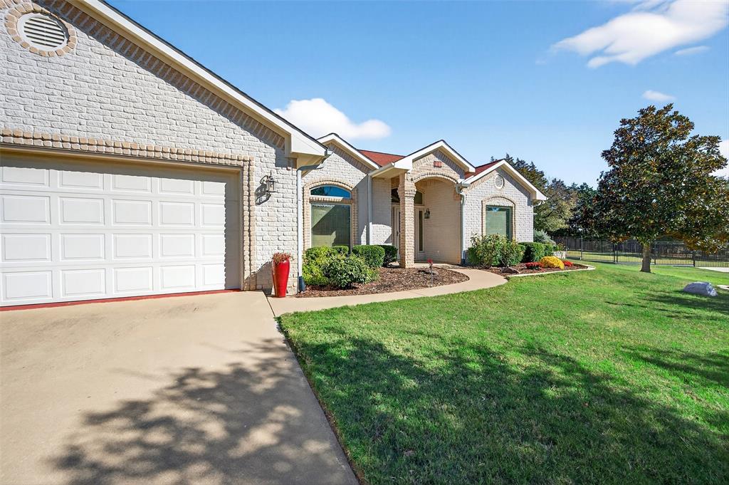 One-of-a-Kind Lake Kiowa Gem on Triple Lot with Two Master Suites. Nestled on a serene 1.57-acre triple lot on the north side of Lake Kiowa, this Southwest-style home offers privacy, space, and character at every turn. From the moment you step inside, you’ll be captivated by the custom details, beautiful tile flooring, handcrafted tree-post accents, unique sconces & formal den.The primary master suite is truly a retreat, featuring room for a sitting area, seperate vanities plus a dedicated makeup vanity, a corner jetted tub, a custom walk-in shower and an extraordinary closet complete with built-in storage, seasonal upper shelving & shoe rack. The 2nd master suite offers its own luxury touches with dual vanities, a corner tub, a glass walk-in shower & walk in closet. Designed for both comfort and entertaining, the open living area includes a brick gas fireplace, hardwood floors, a built-in coffee bar, and a wall of windows that frame views of your beautiful private backyard. The newly updated kitchen with custom granite counter tops, sink and fixtures features stainless steel appliances, gas cooktop, long breakfast bar & tons of storage. You’ll also find a formal dining room & a dedicated office with extensive built-ins and a built-in desk. Step outside to your backyard oasis, complete with a covered patio stretching nearly the full width of the home. Enjoy views of mature trees within your fully fenced yard, enclosed by black wrought iron fencing with concrete footers for durability. A separate dog run includes a climate-controlled dog room (which could double as a workshop) just off the secondary garage. Above the main garage, discover a air conditioned and heated game room or man cave or also perfect for a fourth bedroom, media room, or private retreat. Both garages are generously sized. With its blend of craftsmanship, comfort and privacy, this Lake Kiowa treasure is a must have. Schedule a showing today and experience all that this remarkable home has to offer.