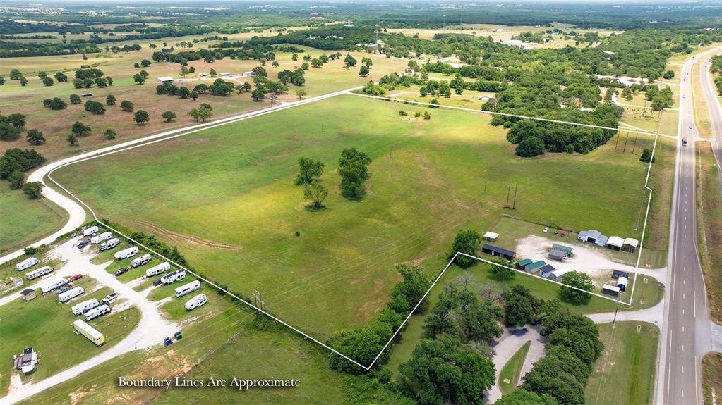 Prime commercial opportunity with exceptional visibility and access! This 30.99-acre tract offers approximately 900 feet of frontage along highly traveled Hwy 82 with an estimated traffic count of 19,500 vehicles per day, creating outstanding exposure for future development. Additional frontage along CR 147 provides added accessibility and flexibility for site planning. Located outside city limits, this property offers fewer development constraints while currently benefiting from an agricultural exemption. Deed restrictions are in place to help protect long-term value and surrounding development quality, prohibiting RV parks, mobile home parks, junkyards, and scrap metal yards. With strong highway presence, dual road frontage, and ample acreage, this property presents an excellent opportunity for commercial, investment, or future development use in a growing corridor.