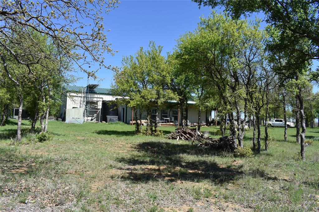 Amazing Ranch property with high peak area and scenic views. Great for uses such as hunting and other recreational activities with a very diverse tree and vegetations all over. The property has been improved with electrical service, addition of a large Warehouse and a living Cabin. The Large Warehouse, about 3200 SF supports various needs for storing equipment, supplies, machinery or vehicles. Delightful and pleasing diverse terrain with various elevation changes from creek with floodplain to high peak rocky tops areas. These variations combine to provide for stunning views in all directions. With west fork trinity river on the edge, it offers various wildlife and a great hunting ground with a Blind on the property.