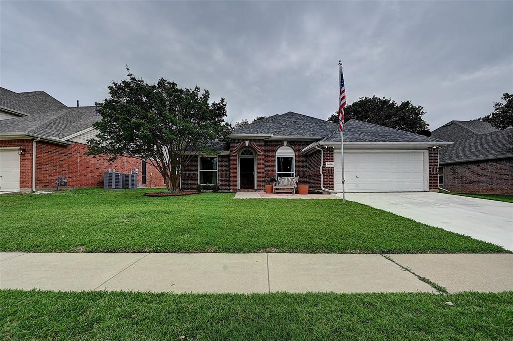 Spacious and beautifully maintained 4-bedroom, 2-bath home nestled under gorgeous shade trees in sought-after Park Glen! This versatile floorplan offers two large front living areas perfect for a home office, formal dining, sitting room, or playroom. The heart of the home features a spacious kitchen with abundant counter space, center island, breakfast bar, and open flow to the dining area and oversized family room — ideal for entertaining. Large windows across the back of the home fill the space with natural light. The split primary suite offers privacy and includes an updated bath with dual vanities, jetted tub, walk-in bathtub, and frameless glass shower. Secondary bedrooms are generously sized with ample closet space. Relax outdoors on the covered patio surrounded by mature trees and landscaping. Located in desirable Keller ISD with access to Park Glen community amenities and in PID 6.