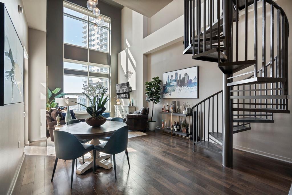 Modern two-story PENTHOUSE Condo located on 7th floor of The Terrace - 2025 winner of Community of the Year for high rise condominiums. Perfect downtown Dallas location allows you to walk to the American Airlines Center, House of Blues, Katy Trail and endless other entertainment options. Soaring 23 ft ceilings with stunning city views from both stories. One rooftop balcony and one terrace balcony to enjoy the skyline from. Primary bedroom and full bath located downstairs with a loft and half bath located up. Loft is great for an office or bonus room. New paint throughout and new automatic blackout shades make this the perfect, move-in ready place to call home. Community amenities include a pool, fitness center, grill area and concierge services. One underground assigned parking spot included. 1% temporary rate buydown when using preferred local lender - reach out to agent for more details.