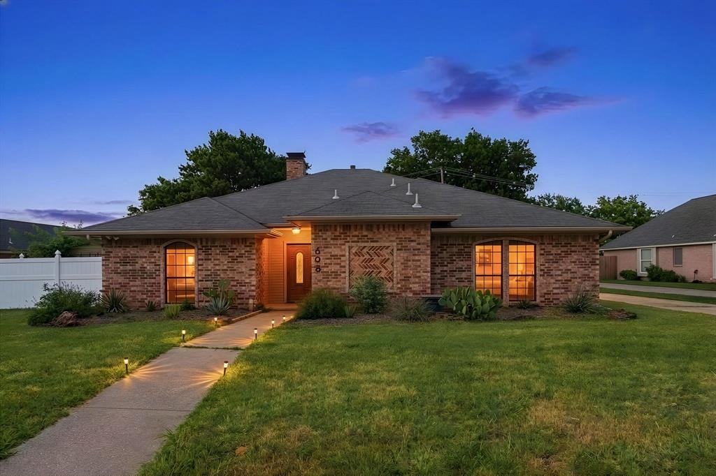 Ideally located just minutes from I-35 and FM 407, this charming home offers the perfect blend of comfort, functionality, and convenience in an established neighborhood—making daily commuting a breeze. Located just a block from Lower Sellmeyer Park, this home also feeds to Heritage Elementary School and Marcus High School. Enjoy close proximity to upscale shopping and dining at the The Shops at Highland Village, along with popular retailers like T.J. Maxx, HomeGoods, Whole Foods Market, and LA Fitness—plus more premier shopping and dining nearby. Step inside to an expansive main living area featuring beamed ceilings that create a warm, inviting atmosphere. A second spacious living area with vaulted, beamed ceilings provides incredible flexibility—perfect for a game room, pool room, office, or playroom. The home offers both a formal dining room and a cozy breakfast area off the kitchen. The split bedroom floor plan adds privacy, with the oversized primary suite featuring crown moulding and an updated bath with separate shower and dual vanities. The secondary bath includes a granite vanity and floating sink. The home has NO CARPET throughout, offering easy maintenance and a clean, modern feel. Recent upgrades provide excellent value and peace of mind, including a new HVAC system, new water heater, and energy-efficient windows on the south and rear of the home. Solar screens on the front windows will help with the Texas heat! Outside, enjoy a stamped concrete patio ideal for entertaining, a large storage shed for tools or extra storage, and a sprinkler system to maintain the yard. The gated rear-entry garage includes an extended driveway and additional paved area behind it, offering ample parking with room for a boat or RV. Refrigerator, washer, and dryer are included—making this home truly move-in ready.

This well-maintained home offers great space, updates, and a prime location—ready for its next owner to make it their own!