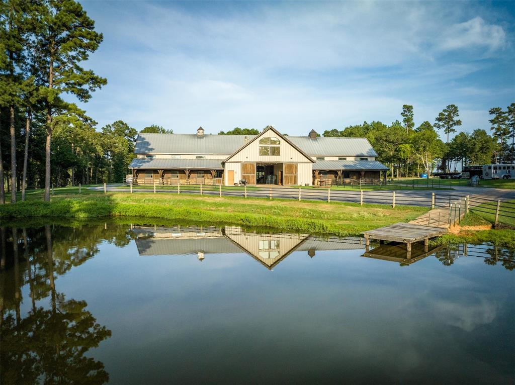 Incredible opportunity to own one of the top horse facilities in east Texas. Anding Acres is a premier equine show horse facility on 88.210 acres in Upshur County. Just north of Longview with easy access to I-20. As you enter through the prestigious pipe and rock front entry you will take paved roads all the way to the barns and housing. The main barn has 1o 14 X 14,  Hadite block stalls, climate controlled Lab, feed room, office and bath.  double wash rack, tack room, vet room, stocks, turnouts and concrete floors with vaulted cathedral ceilings. The main home is 2,780 sq. ft. barndo  upstairs has 2 bedroom, 2 baths, living room, kitchen, vaulted ceilings and incredible views. There is a covered arena with full screens and 10 large mare and foal stalls with automatic waterers, fans, LED lighting.  and equipment storage. Three ponds, multiple pastures with sandy loam soil and coastal bermuda  grass. There is a mobile home for help, enclosed concrete floored shop with roll up doors.