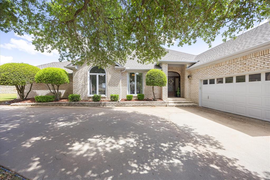 Beautiful golf course home in the sought-after community of Pecan Plantation, perfectly positioned on the 7th green. This 3-bedroom, 2.5-bath home offers 2,487 square feet with a 2-car garage plus dedicated golf cart space—ideal for enjoying the golf course lifestyle. Step inside to find updated luxury vinyl plank wood-look flooring, fresh interior paint, and an updated kitchen designed for both everyday living and entertaining. Bathrooms feature new countertops and fixtures, while a recently installed roof adds peace of mind. The true showstopper is the wall of picture windows stretching across the back of the home, flooding the living areas with natural light, and showcasing beautiful golf course views. The oversized outdoor living area provides the perfect setting for relaxing evenings, entertaining guests, or watching play on the green. Most furniture and appliances are available for purchase, making this an excellent opportunity for a move-in-ready or partially furnished home in one of Granbury’s most desirable golf course communities. QUALIFIED BUYERS may be eligible for lender-paid closing cost assistance through a participating lender. Incentive availability, loan approval, and program terms apply. Contact listing agent for additional details.