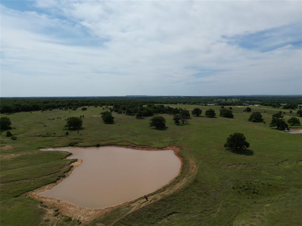 Remarkable 440.18-acre North Texas ranch located in Nocona, offering an impressive combination of functionality, natural resources, and striking topography. This property is highlighted by 11 ponds and multiple water sources, delivering excellent support for livestock and land management.
The ranch features improved pastures, cattle pens, and a hay barn, all complemented by full fencing and cross-fencing for efficient operation. Electric is onsite along with a water well, providing essential infrastructure already in place.
With no restrictions and an existing ag exemption, the possibilities are wide open—ideal for ranching, recreation, or long-term investment. The diverse elevation changes and scenic landscape set this property apart, offering both beauty and practicality.
A rare offering with scale, water, and versatility in a highly desirable North Texas location.
