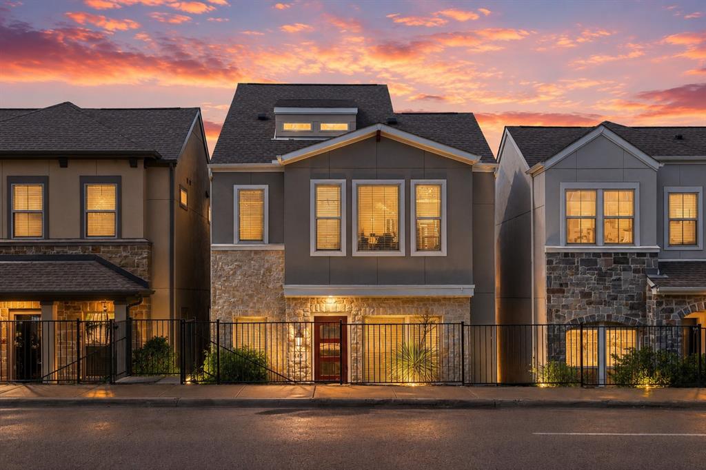 Welcome to this beautifully maintained and thoughtfully designed three-story residence that perfectly blends style, comfort, and everyday functionality. From the moment you arrive, the striking stone and stucco exterior and gated front entry create an inviting first impression with exceptional curb appeal. Step inside to discover a light-filled, open layout with clean lines and contemporary finishes throughout. The home offers multiple spacious living areas, including an expansive upstairs bonus room — ideal for a media space, game room, home gym, or additional lounge area.
The primary suite is a true retreat, featuring a spa-inspired bathroom with a soaking tub, oversized glass walk-in shower, dual vanities, and modern tile work. Generous walk-in closets with built-in shelving provide ample storage and organization. Secondary bedrooms are bright and well-proportioned, while additional bathrooms showcase updated finishes and cohesive design. An upstairs office nook with large windows offers the perfect work-from-home setup with abundant natural light. Enjoy the convenience of an upstairs laundry room located near the bedrooms for effortless daily living. 
Outside, the private gated front yard and landscaped walkway provide charm and added privacy — a rare and desirable feature.
With its modern aesthetic, versatile living spaces, and thoughtful layout, this home offers both comfort and elevated design in one exceptional package. Refrigerator conveys with home and charge port for EV cars.