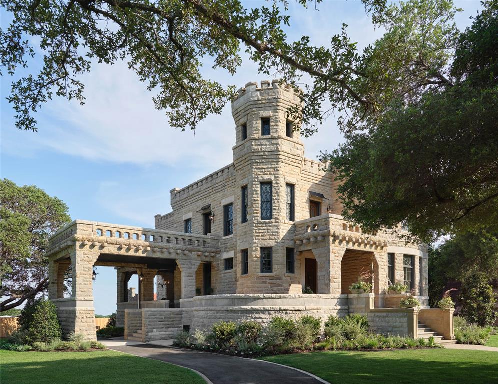 Step into the timeless elegance of the Historic Waco Castle, where history and impeccable design intertwine, welcoming you with transitional style for everyday living and entertaining. Renowned duo Chip and Joanna Gaines—who wanted to honor the historic property by making it a home again—meticulously designed, renovated, and restored this 135-year-old gem, infusing it with warmth and inviting interiors. This exquisite property showcases a seamless blend of historic grandeur and modern functionality. With gorgeous millwork, antique tile floors, and diamond-paned windows, the estate exudes a timeless charm. The heart of the home boasts a formal dining room, great room, and stunning kitchen. Discover unique spaces like a moody card room, a formal library, and a distinctive conservatory. The elegant bedrooms and fully renovated spa bathrooms provide luxurious sanctuaries. All furnishings, accessories, and decor have been thoughtfully curated to complement the home’s design and are included with the purchase, creating a truly turnkey opportunity. Outside, lush landscaping completes the picture-perfect setting. Welcome to a world where luxury and comfort embrace, inviting you to experience the allure of the Historic Waco Castle.