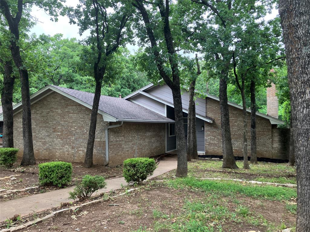 Along a canopy of mature trees in Southwest Arlington’s Wimbledon Addition, 5110 River Ridge Rd brings together space, location, and opportunity in a way that is increasingly hard to find. This new for-sale offering includes 4 bedrooms and 2.5 baths, approximately 2,463 square feet of living space , a move-in-ready that still leaves plenty of room for your preferred renovations, finishes, and value-building upgrades.

Inside, the large living room features a vaulted ceiling, fireplace, and wet bar, creating a central gathering space filled with ambient light. The living area opens to a dining combination. With four bedrooms, the floor plan provides flexibility for guests, work-from-home needs, hobbies, or future reconfiguration as your vision takes shape.

The setting is a true highlight. Established streets, mature landscaping, and a quiet neighborhood feel give the home lasting appeal, while the price point makes the renovation potential especially compelling. Located within well-respected Mansfield ISD, this address offers added long-term desirability for homeowners and investors alike.

Nearby conveniences round out the lifestyle. Mary and Jimmie Hooper Park is just a short distance away for outdoor time, play, and open green space, while Boles Junior High School is nearby along Southwest Green Oaks Boulevard. Shopping, dining, and major Arlington routes are also within easy reach. Bring your ideas and make this well-located home shine.