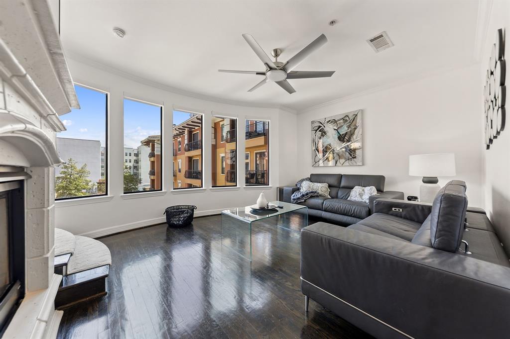 Tucked within one of Preston Hollow's most desirable addresses, this 2BD, 2.5BA residence at The Sorrento on Turtle Creek offers a rare opportunity to enjoy the feel of a townhome within a lock and leave condo setting.  Spanning 2,044SF across three levels, the layout is both functional and inviting, creating a sense of privacy and separation that is hard to find in traditional condo living.  The main living spaces are anchored by an updated kitchen featuring quartz countertops, a built in refrigerator, and high end KitchenAid appliances, all opening seamlessly to the living and dining areas. Wood flooring runs throughout, complemented by updated lighting and electric shades that elevate the overall feel. The primary suite is thoughtfully designed with a fully updated bath, complete with a walk in shower, separate soaking tub, and a custom closet. A secondary bedroom with a built in Murphy bed offers flexibility for guests or a home office.  Enjoy peaceful poolside views and the convenience of a true lock and leave lifestyle, with concierge service, a resort style pool, fitness center, and two secured parking spaces.  All of this in a prime location, just minutes from the DNT, convenient access to both Love Field and DFW Airport, and surrounded by some of Dallas' premier shopping and dining.