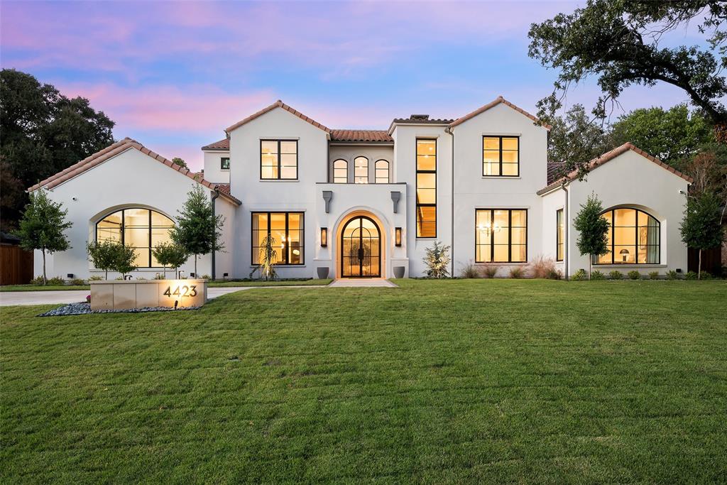 This strikingly handsome Hayes Signature Home set on a half-acre lot in Preston Hollow was just completed in October 2024 with about $400,000 of custom design and technology upgrades. The Santa Barbara transitional home designed by John Lively & Associates is perched on this elevated and maturely landscaped lot.  No expense was spared from the quality of construction to the tasteful custom finishes as this was intended to be the Seller’s primary residence. One will have peace of mind with a transferable 1-2-6 builder warranty, as well as a Generac whole home generator. Texadia Systems installed smart home features including Control 4 home automation, Lutron switches, Eero mesh Wi-Fi, security system with cameras and motorized shades throughout. This brand-new home is as turnkey as they come. The expansive downstairs floor plan offers multiple entertaining spaces, a primary suite and guest suite, office and media room – allowing one to primarily live on one level.  The media room or second living space opens to one of two covered, phantom screened terraces, one with an outdoor kitchen featuring a Lynx built-in grill, and the other with a cast stone fireplace. The large Zoysia grassy backyard is lined with mature trees with up lighting and offers plenty of space if one desires a pool.  The gourmet kitchen features a Subzero refrigerator, wine cooler and beverage center plus 7-burner Wolf range-top, double oven, warming drawer and built-in microwave surrounded by rift-cut white oak cabinetry.  Between the kitchen and media is a bar adorned in gorgeous Emerald Green quartzite.  The spa-like primary suite boasts dual closets, water closets, vanities and an incredible walk-in shower – all decked with beautiful, high-end finishes. The upstairs layout has 3 ensuite bedrooms, gameroom and spacious flex room that would make a great home gym. Located near the top private schools in Dallas with quick access to upscale shopping, restaurants and downtown.