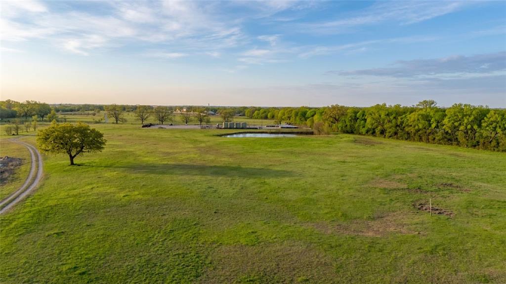 Welcome to your slice of Texas paradise! Situated on 71.61 breathtaking acres in sought-after Ponder ISD, this versatile ranch property offers the perfect blend of comfort, functionality, and wide-open space. This 3-bedroom, 2-bath home features a spacious kitchen designed for gathering, with a well-thought-out layout that flows effortlessly for everyday living. Whether you’re hosting family or just enjoying a quiet evening in, this home was built with practicality and comfort in mind. Brand new water well installed March of 2023. Step outside and take in the beauty of the land—partially treed with a pond and direct access to Denton Creek, offering endless opportunities for fishing, hunting, and recreation right in your backyard. The acreage is ideal for a cattle operation, horses, or simply enjoying the ranch lifestyle Texas is known for. Properties like this don’t come around often—productive land, natural water features, and a move-in ready home all in one package.