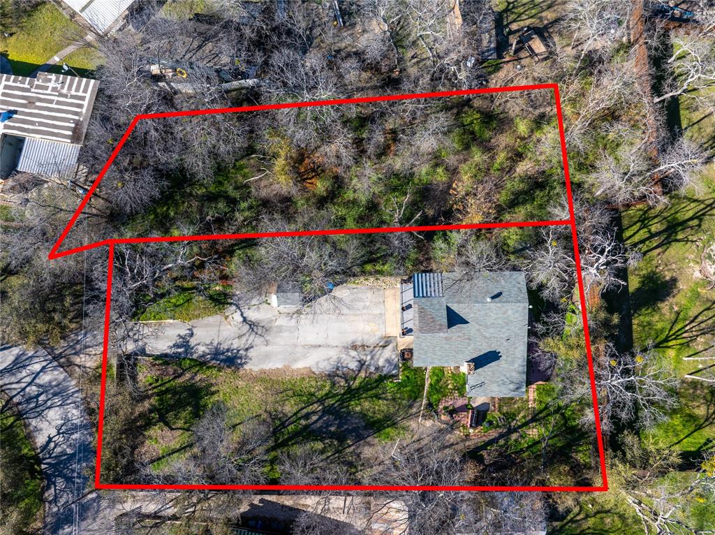 A rare opportunity to own over half an acre across from Lake Worth, this unique property includes two adjacent lots, one with a residence and one vacant, offering endless potential for expansion, investment, or creating your ideal outdoor retreat. The split level home features a spacious second floor balcony with peaceful lake views, perfect for morning coffee or evening gatherings. Inside, the home has been thoughtfully refreshed and offers a warm, inviting feel throughout. The main bedroom serves as a private retreat with its own fireplace and an updated en suite bath. A standout feature is the attached ground floor guest studio with a private entrance, complete with a full kitchen, bathroom, and washer dryer hookups. This flexible space is ideal for a home office, guest suite, gym, or even income producing potential. The fully fenced property includes RV parking with an electrical hookup, adding even more versatility. Both 4838 Williams Spring and the adjacent vacant lot at 4832 Williams Spring are included in the sale, creating a one of a kind opportunity just moments from the lake.